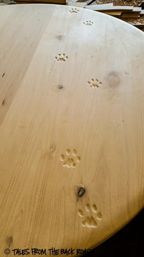 Custom table and chairs carved bobcat tracks