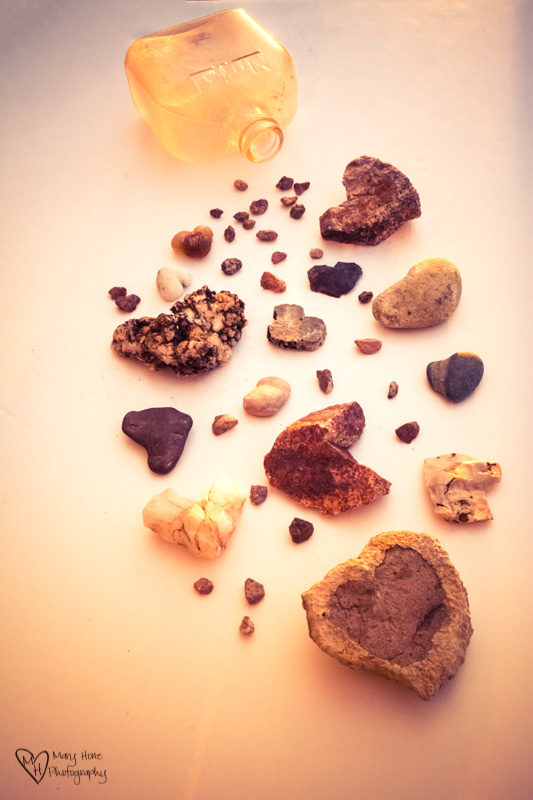 heart rocks and an old bottle